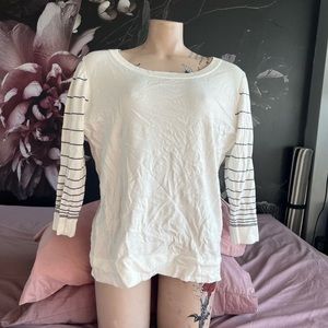 Woman’s top with striped sleeves